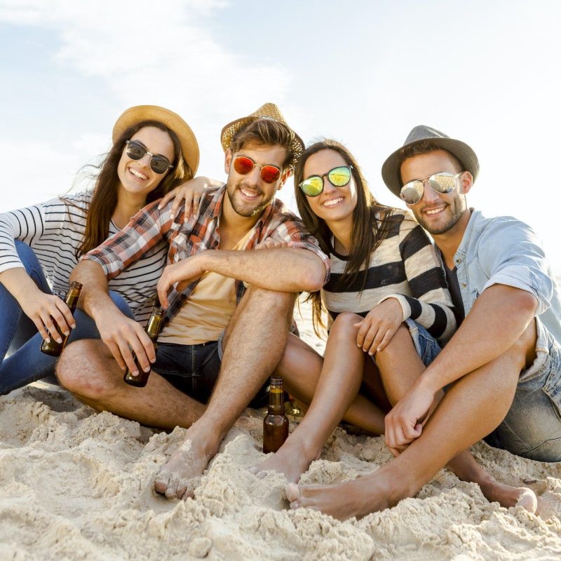 Group of Friends Relaxing On Beach