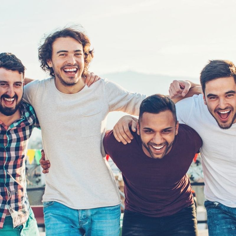 Group Of Men Smiling After Recovery